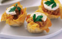 Caramelized onion and goat cheese tarts prepared by FoodByWayne