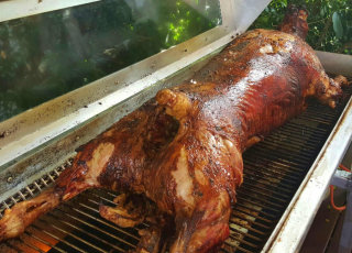 Whole spit roasted lamb by FoodByWayne